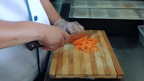 Close-up of Chef Cutting Carrots Stock Footage 160886710