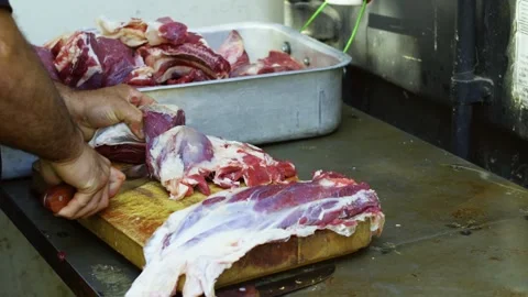 Close-up chef cutting raw meat on board for pilaf Stock Footage 346745511