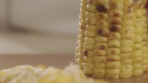 Close-up of chef cutting with sharp knife baked over a campfire corn salad Stock Footage 114544684