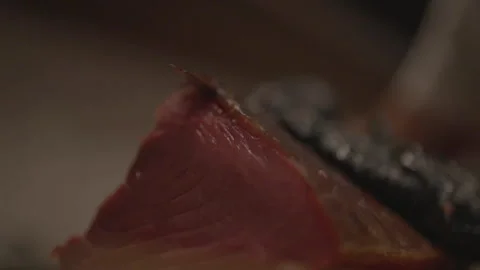 Close-up of chef cutting slice of meat Stock Footage 336374469