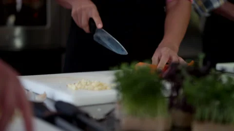 Close up of chef cutting vegetable at kitchen. Stock Footage 64115774