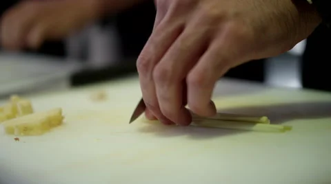 Close up of chef cutting vegetable at kitchen. Stock Footage 64115834