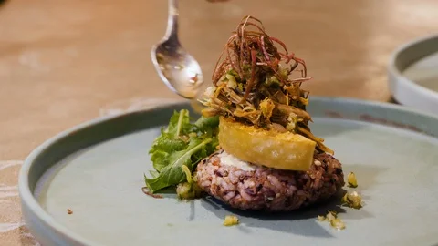 Close up of chef decorating delicious appetizer in kitchen in Kuala Lumpur Stock Footage 146545260