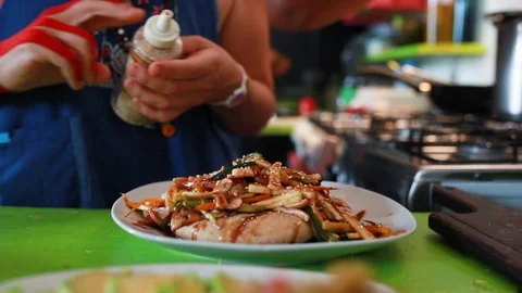 Close up of chef decorating plate with asian food,  Barichara, Colombia Stock Footage 135247973