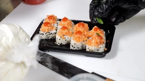 Close-up of the chef decorating the prepared sushi with microgreens. Stock Footage 327275205