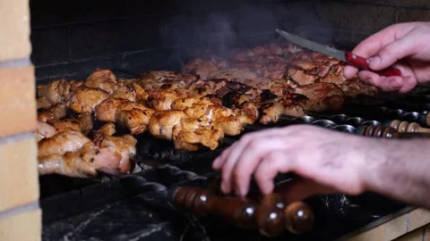 Close-up of a chef frying a barbecue in a restaurant kitchen. Stock Footage 320877811