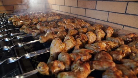 Close-up of a chef frying a barbecue in a restaurant kitchen. Stock Footage 341316595