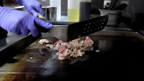 Close-Up of Chef Frying Chopped Meat on Frying Stove in Restaurant Kitchen Stock Footage 288576420
