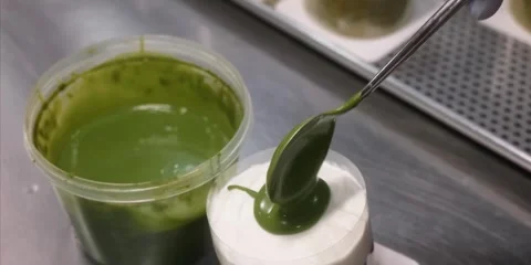 Close-Up of Chef Glazing a Gourmet Matcha Mousse Cake with Green Tea Ganache 스톡 동영상 343589014