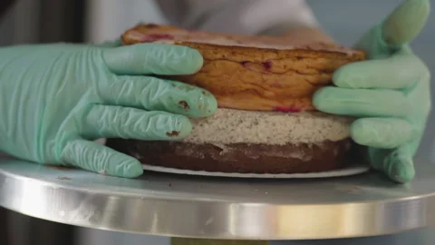 Close-up, Chef in Gloves Collects Cake on Turning Table Stock Footage 140725888