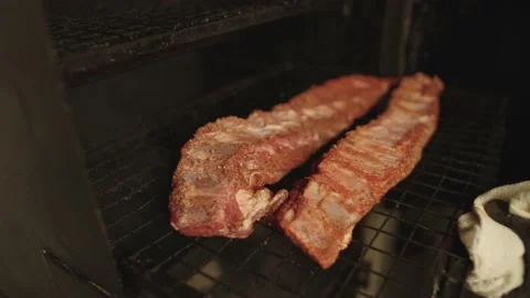 Close-up of a chef grilling ribs in a restaurant kitchen. Stock Footage 236900846