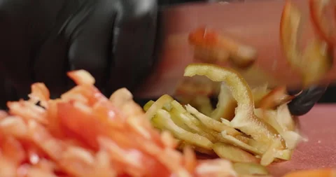 Close-up chef hand chops juicy red bell pepper. Male hands cut vegetables Stock Footage 269064050