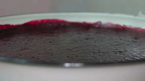 Close-Up of Chef Hand Mixing Fresh Homemade Berry Jam in a Large Glass Bowl Stock Footage 339630745