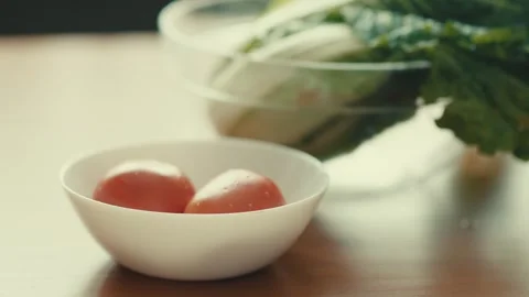 Close Up of Chef Hand Picking Up Black Sheet of Nori Seaweed Above Bowl Stock Footage 347128484