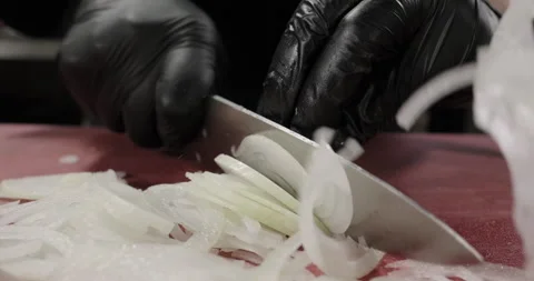 Close-up chef hand slicing onion on the cutting board Stock Footage 274364831