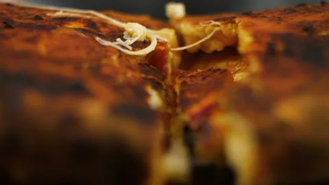 Close-up of chef hand taking a delicious piece of pizza with salami pickles Stock Footage 136478621