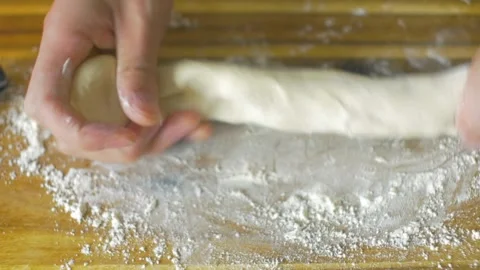 Close-up of chef hands baker preparing bread dough kneading raw dough on wo.. Stock Footage 272468531