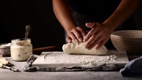 Close-up of chef hands baker preparing bread dough kneading raw dough on wo.. Stock Footage 272468580