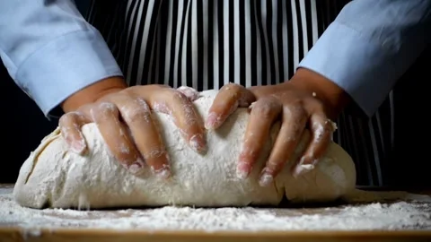 Close-up of chef hands baker preparing bread dough kneading raw dough on wo.. Stock Footage 272468785