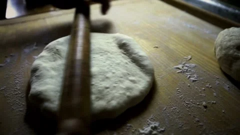 Close-up of chef hands Baker rolling bread dough home made bread production.. Stock Footage 272470130