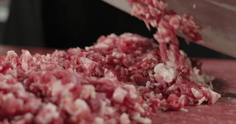 Close-up chef hands chop the meat with a big knife. Preparation of minced meat Stock Footage 258551280