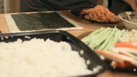 Close-up of chef hands cooking and preparing Asian food and sushi in restaurant Stock Footage 69787578