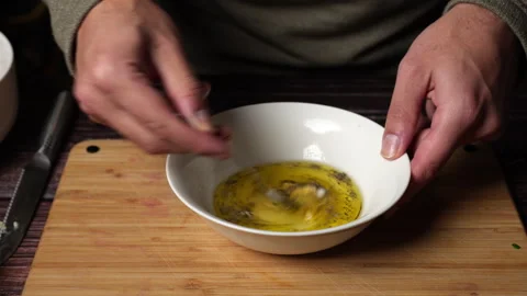 Close up of chef hands mixing a salad dressing vinaigrette. Video stock 301444157