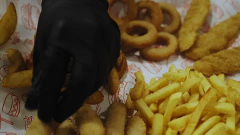 Close-Up of Chef Hands Plating Fried Appetizers Stock-Footage 307088082