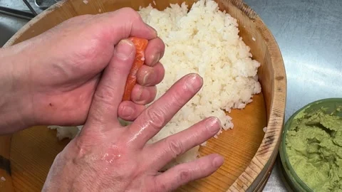 Close-Up Chef Hands Shaping Fresh Salmon Nigiri Sushi on Palm, Japan Stock Footage 345202177