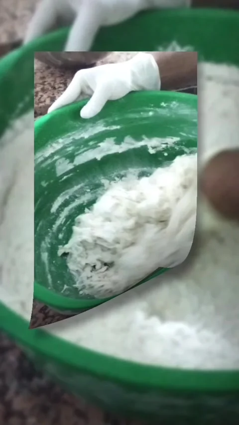 Close-up of chef hands in white gloves kneading fresh dough in a bowl Stock Footage 330574141