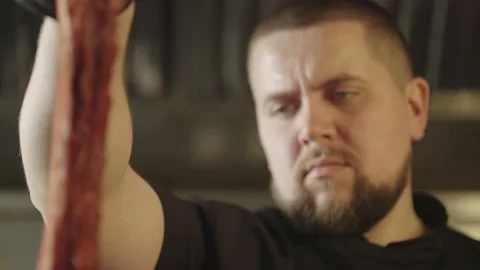 Close-up of chef holding ribs ready for grilling. Stock Footage 236044944