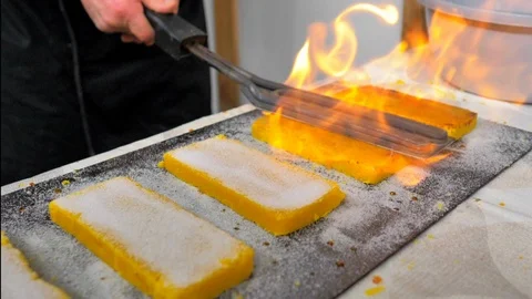 Close-up chef iron burning yolk nougat pills Stock Footage 124379612