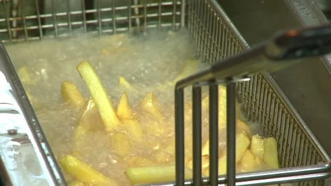 Close up. Chef in the kitchen preparing french fries. Sequence. Video stock 82281040