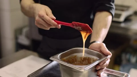 Close up. A chef makes ganache to decorate desserts. Stock-Footage 233294815