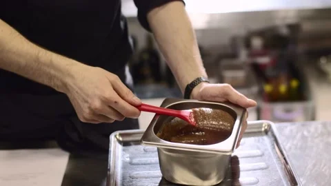 Close up. A chef makes ganache to decorate desserts. Stock-Footage 233294954