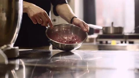 Close up. A chef makes ganache to decorate desserts. Stock Footage 233299636