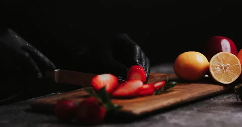 Close-up Chef Man Cuts Strawberry on Wooden Cutting Board. Healthy Ingredien Video stock 148245865