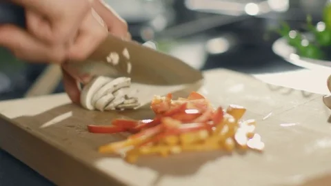 Close-up of a Chef Masterfully Cutting Colorful Vegetables and Mushrooms Stock Footage