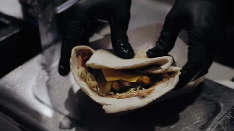Close-Up of Chef Placing Freshly Made Quesadilla on Plate Stock Footage 307069032