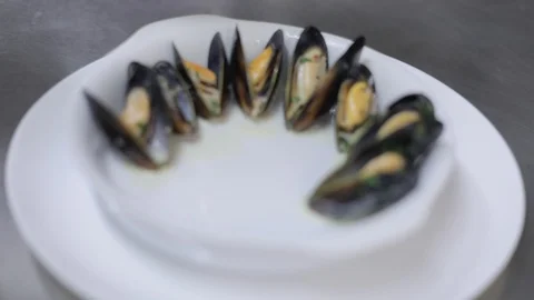 Close Up of Chef Plating Beautiful Mussels Dish Stock Footage 129337884