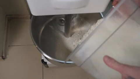 Close-up of the chef pouring flour into a dough processor. 스톡 동영상 344038541