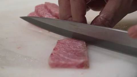 Close up at chef precutting otoro sashimi Stock Footage 238503300