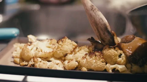 Close Up of a Chef Preparing Cauliflower and Mushroom Based Food Stock Footage 130964559