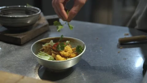 Close-up chef preparing a dish in a restaurant Stock Footage 247011275