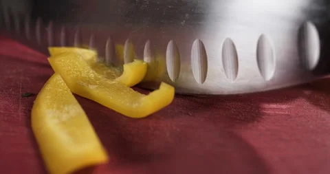Close-up chef preparing healthy vegetable salad meal, chopping yellow bell Stock Footage 291707675