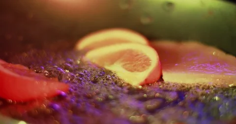 Close-up of a chef preparing oranges in a pan. Stock Footage 103382489