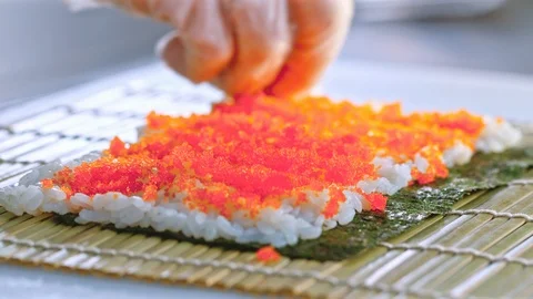 Close up of a chef preparing sushi roll in a restaurant Stock-Footage 85591147