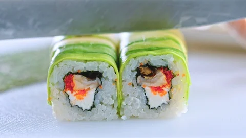 Close up of a chef preparing sushi roll in a restaurant Stock Footage 85598721