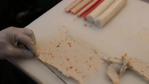 Close-up of Chef Preparing Traditional Korean Fish Cakes (Eomuk) on White Cuttin Video stock 337373264