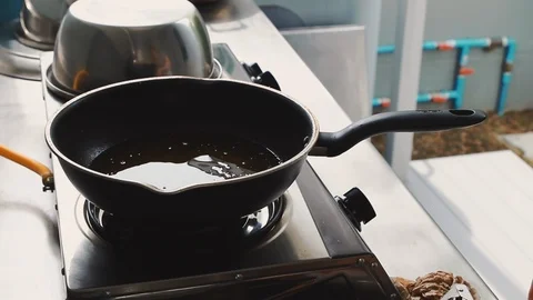 Close up of chef put shrimp into boiling oil to cook deep fried shrimp Stock Footage 113392761